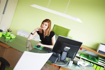 pretty-young-business-woman-using-computer-at-desk.jpg